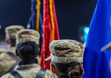 The 380th AEW Honor Guard presents the colors at a Baseball United game