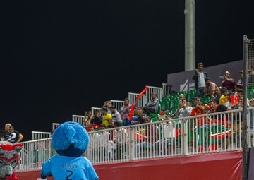 The 380th AEW Honor Guard presents the colors at a Baseball United game