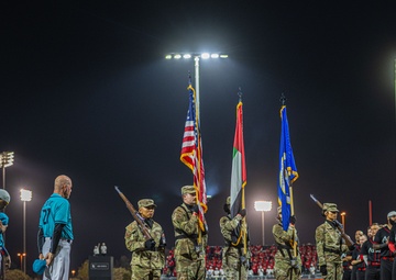 The 380th AEW Honor Guard presents the colors at a Baseball United game