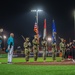 The 380th AEW Honor Guard presents the colors at a Baseball United game