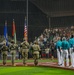 The 380th AEW Honor Guard presents the colors at a Baseball United game