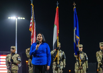 The 380th AEW Honor Guard presents the colors at a Baseball United game