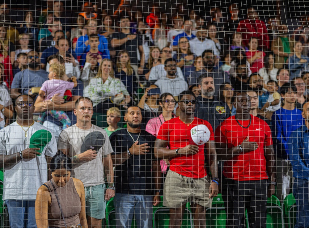 The 380th AEW Honor Guard presents the colors at a Baseball United game