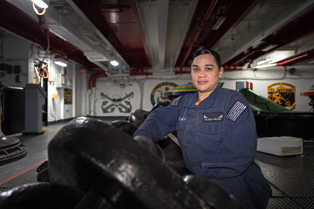 USS John C. Stennis (CVN 74) Sailor Poses For Photo