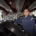 USS John C. Stennis (CVN 74) Sailor Poses For Photo