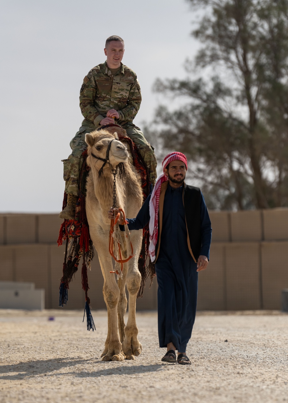 Airmen journey through the sands with a bazaar and camel riding