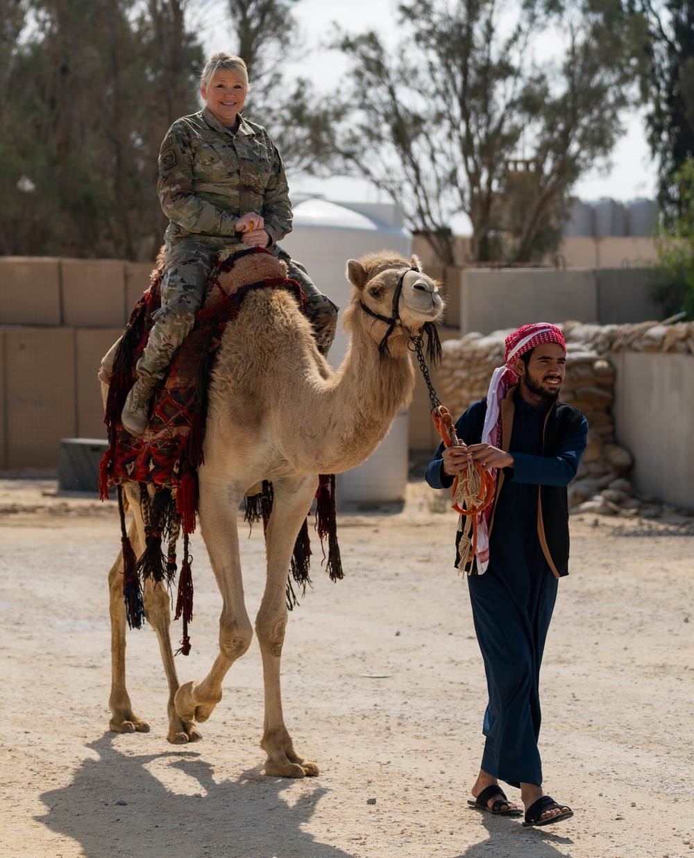 Airmen journey through the sands with a bazaar and camel riding