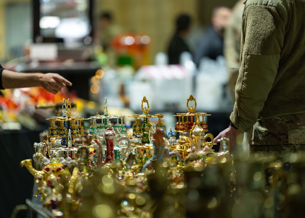 Airmen journey through the sands with a bazaar and camel riding