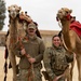 Airmen journey through the sands with a bazaar and camel riding