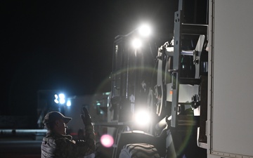 Staff Sgt. James Cambell Supervises the Unloading of Essential Equipment