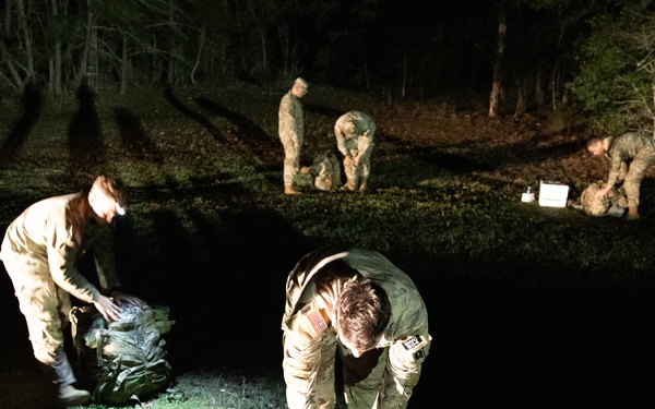 Soldiers Pack for Ruck March After Night Outside