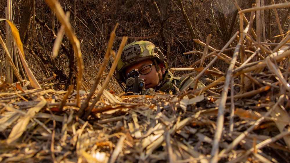 KATUSA Soldier with 1-2 Stryker Brigade Secures Defensive Position - CALFEX 2025