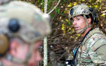 Airman Assesses the Situation During MOSAIC GECKO II