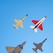 F-22 Raptor performs alongside two Tigers and a Falcon