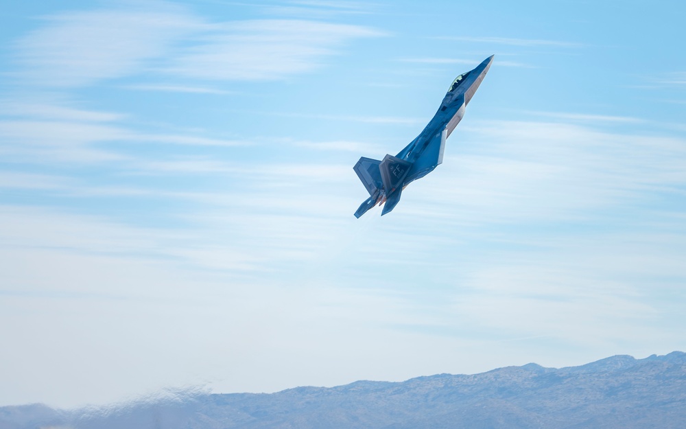 F-22 Raptor performs alongside two Tigers and a Falcon