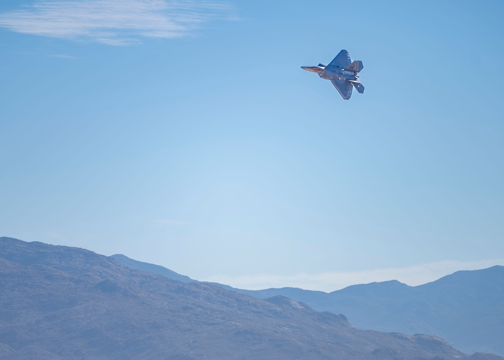 F-22 Raptor performs alongside two Tigers and a Falcon
