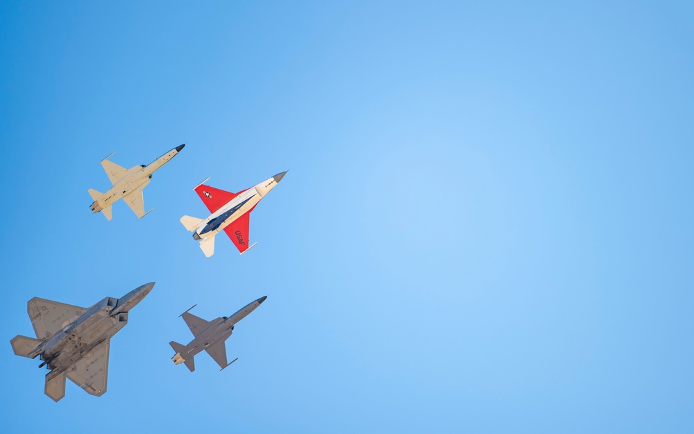 F-22 Raptor performs alongside two Tigers and a Falcon