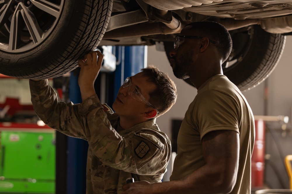 U.S. Soldiers conduct maintenance on CBP vehicles