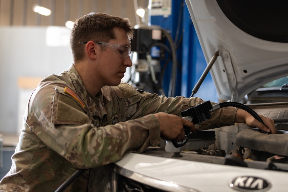 U.S. Soldiers conduct maintenance on CBP vehicles