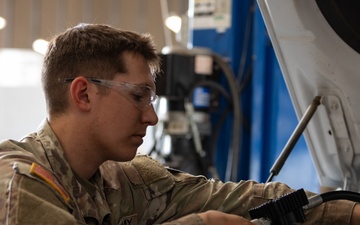 U.S. Soldiers conduct maintenance on CBP vehicles