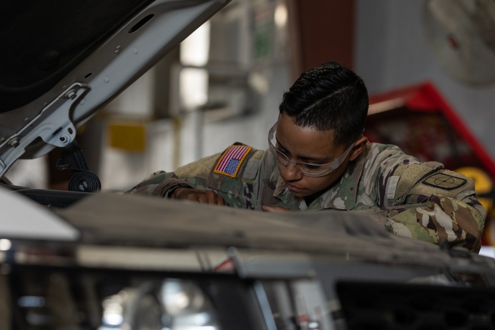 U.S. Soldiers conduct maintenance on CBP vehicles