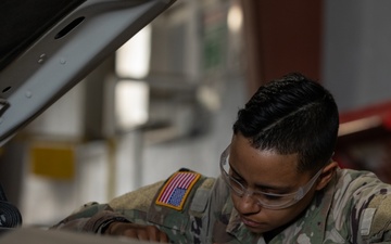 U.S. Soldiers conduct maintenance on CBP vehicles