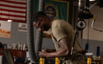 U.S. Soldiers conduct maintenance on CBP vehicles