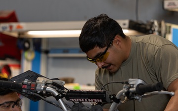 U.S. Soldiers conduct maintenance on CBP vehicles