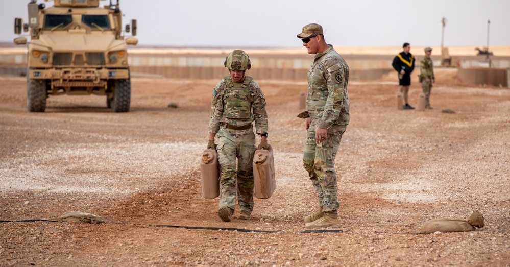 Mortars Platoon Sergeant Motivates Fellow Soldier During 50-Meter Water Can Carry During EPFA