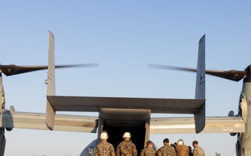 U.S. Marine Corps MV-22B Osprey and U.S. Navy C-130T Hercules aircraft provide assault support to Marines with MWSS-272