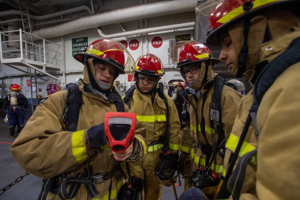 USS Ronald Reagan (CVN 76) Sailors participate in a damage control training drill