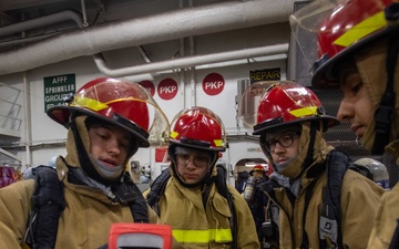 USS Ronald Reagan (CVN 76) Sailors participate in a damage control training drill