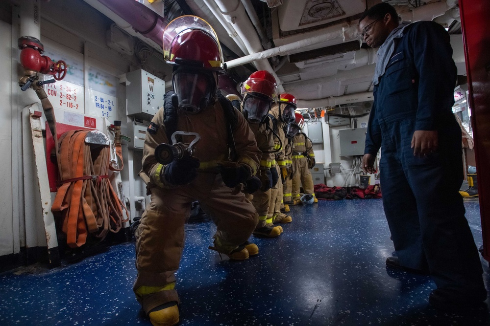 USS Ronald Reagan (CVN 76) Sailors participate in a damage control training drill