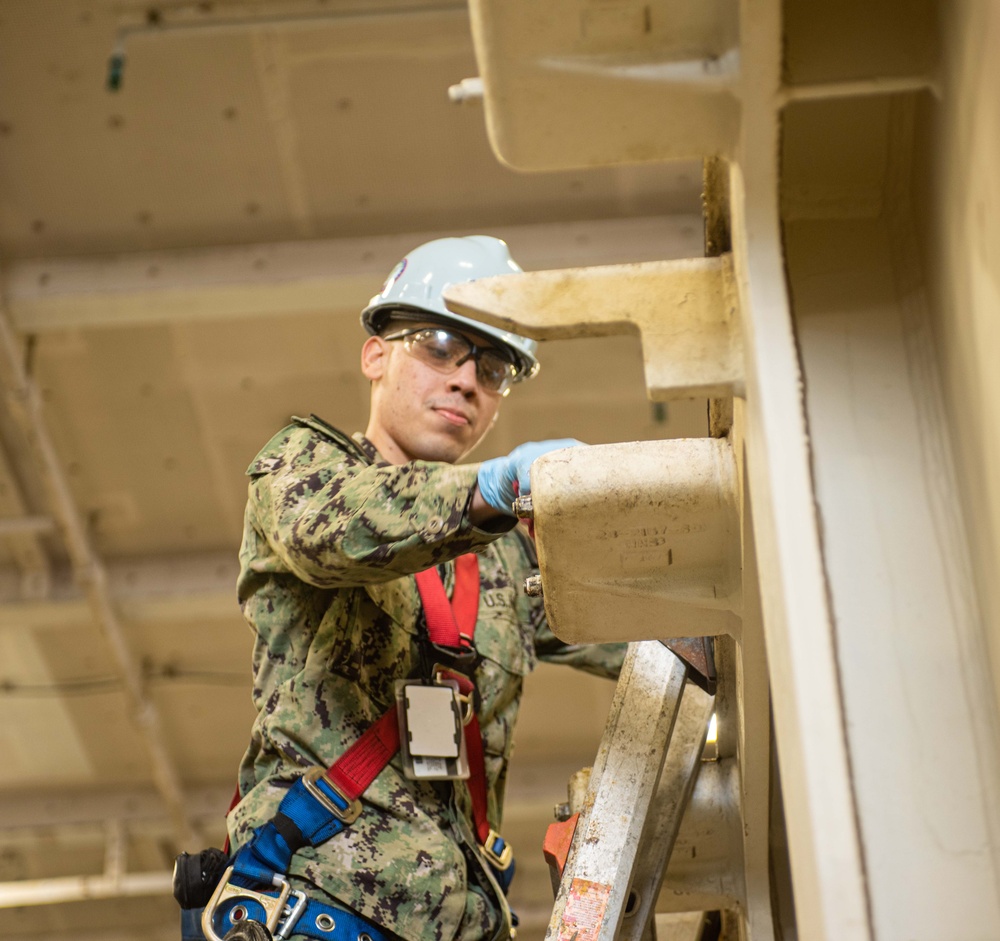 USS Ronald Reagan (CVN 76) performs maintenance and inventories equipment