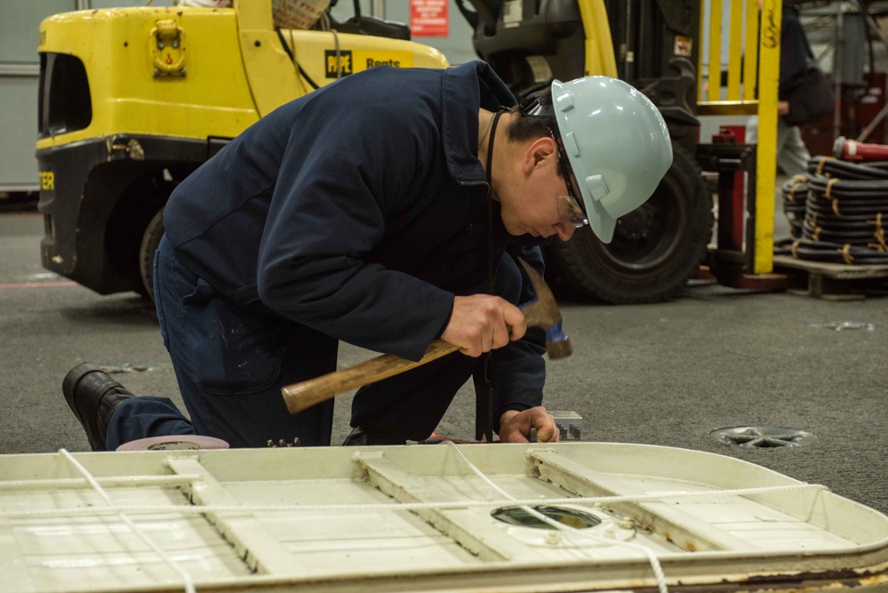 USS Ronald Reagan (CVN 76) conducts door maintenance