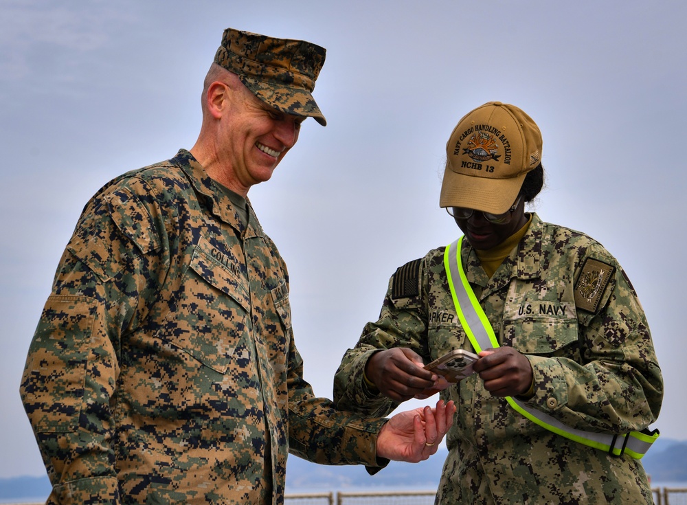 USMC Brigadier General Collins congratulates Navy Sailors on the USNS Dahl