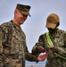 USMC Brigadier General Collins congratulates Navy Sailors on the USNS Dahl