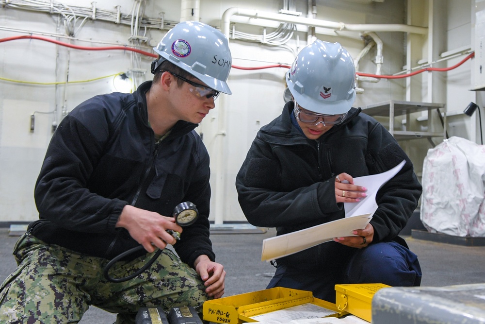 USS Ronald Reagan (CVN 76) Sailors perform maintenance