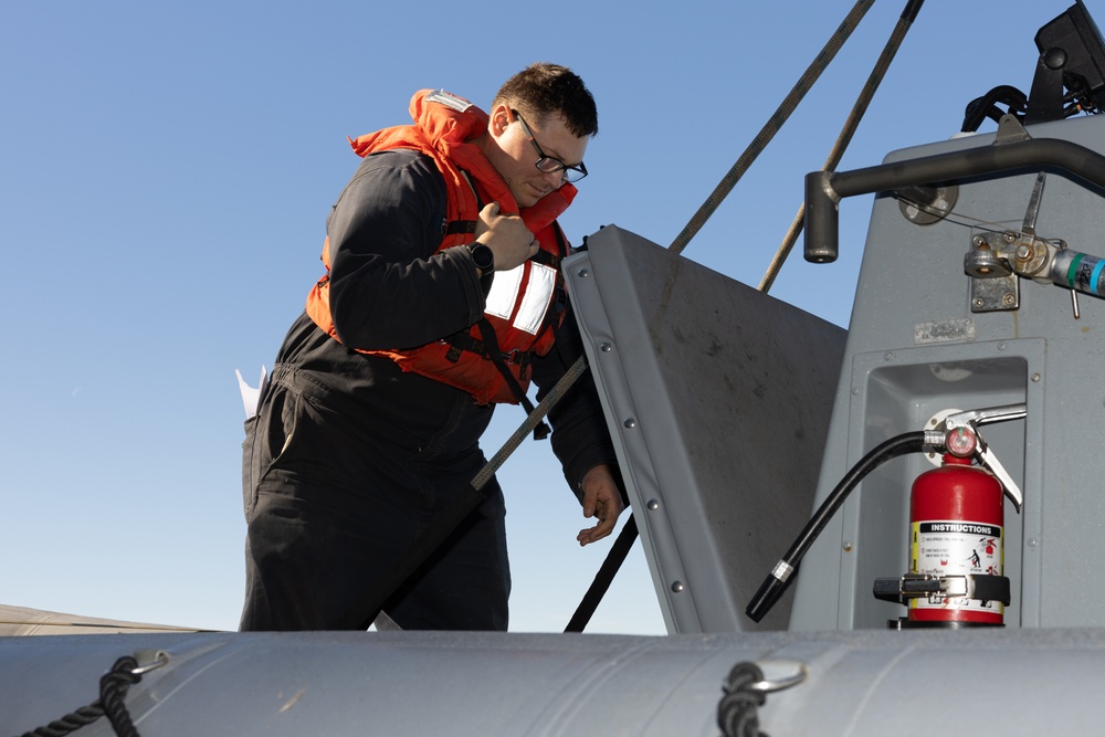 Curtis Wilbur Sailor Conducts Small Boat Maintenance