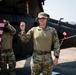 U.S. Air Force Tech. Sgt. Zachary Quicke receives a challenge coin after taking the oath of reenlistment in Thailand, during Joint Exercise Cobra Gold 25