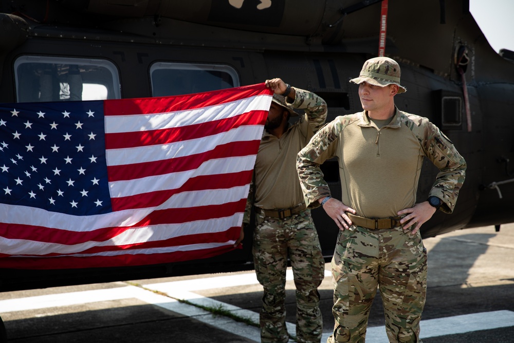 U.S. Air Force Tech. Sgt. Zachary Quicke is given the oath of reenlistment in Thailand, during Joint Exercise Cobra Gold 25