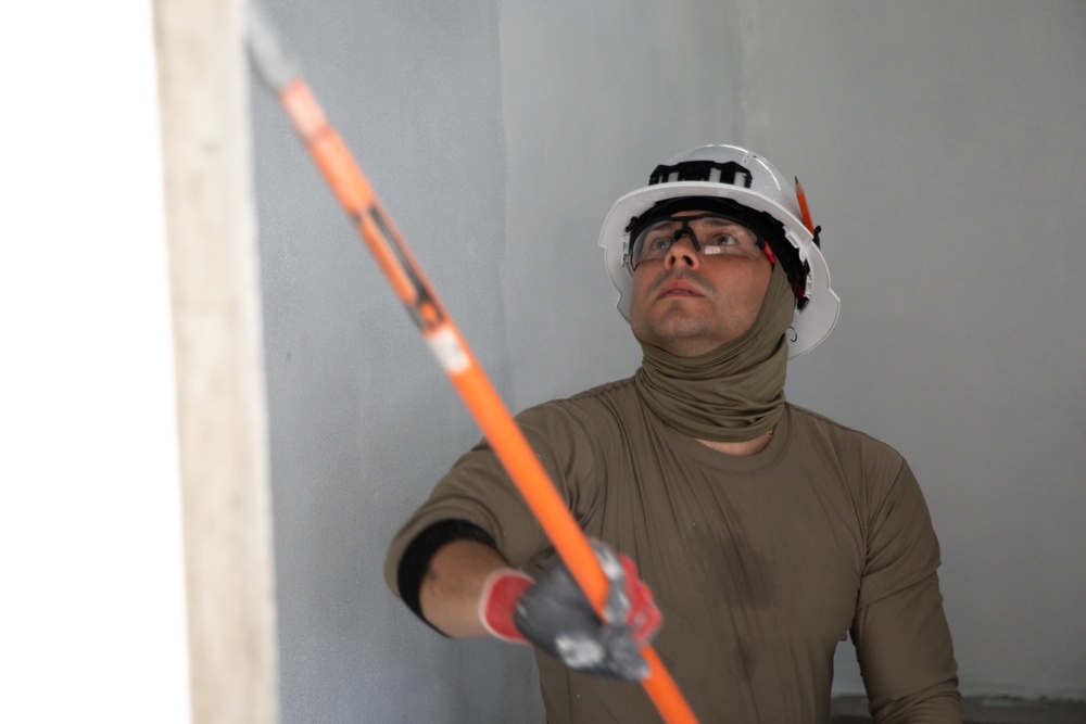 U.S. Air Force Senior Airman Joel Daxel participates in the building of a school near Lop Buri, Thailand, during Joint Exercise Cobra Gold