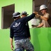 U.S. Air Force Senior Airman Joshua Hartley participates in the building of a school near Lop Buri, Thailand