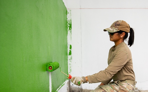 U.S. Air Force Senior Airman Antonio Leizeveil Vann participates in the building of a school near Lop Buri, Thailand