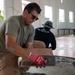 U.S. Air Force Senior Airman Gabriel Earnest participates in the building of a school near Lop Buri, Thailand