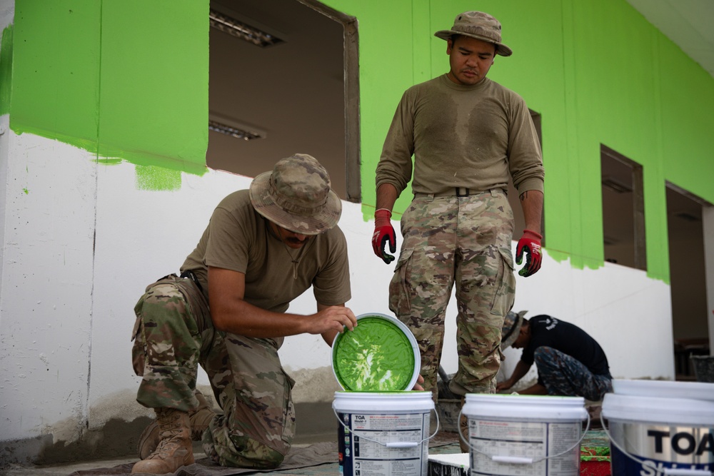 U.S. Air Force Airmen, of the 356th Expeditionary Prime Base Engineer Emergency Force Squadron, participates in the building of a school near Lop Buri, Thailand, during Joint Exercise Cobra Gold 25