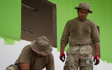 U.S. Air Force Airmen, of the 356th Expeditionary Prime Base Engineer Emergency Force Squadron, participates in the building of a school near Lop Buri, Thailand, during Joint Exercise Cobra Gold 25