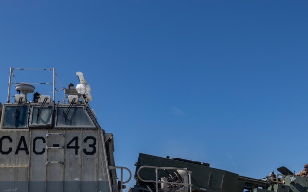 QUART 25.2: Marines and Sailors perform LCAC drills with HIMARS