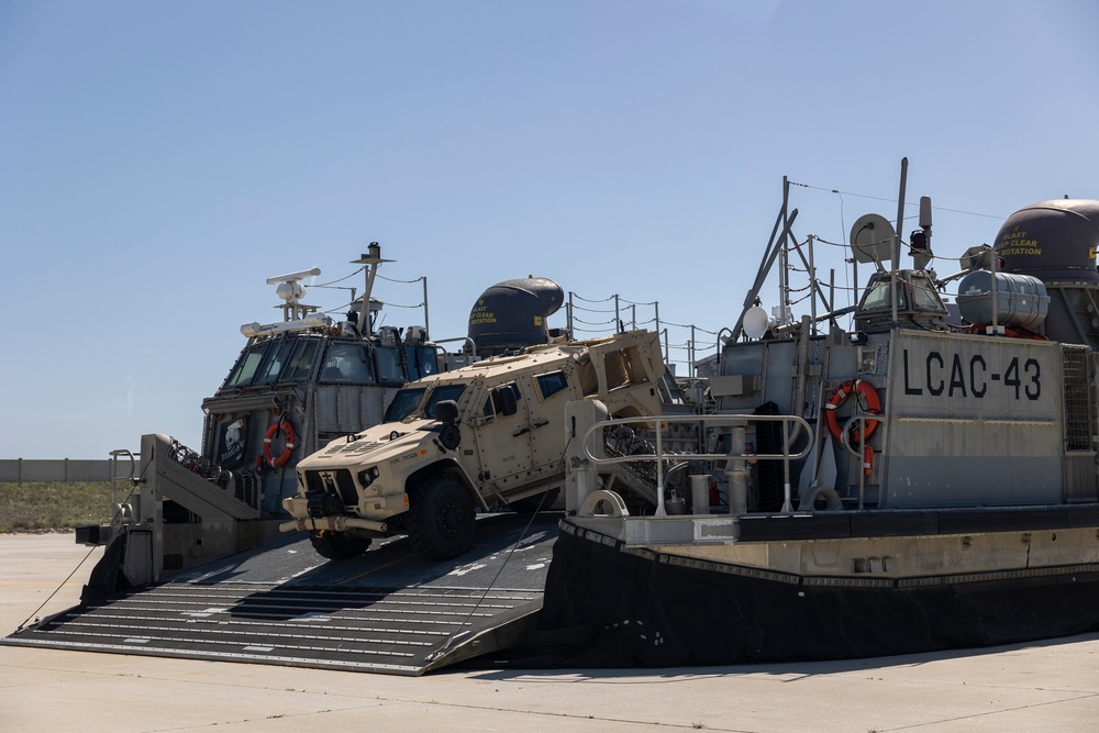 QUART 25.2: Marines and Sailors perform LCAC drills with HIMARS