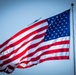 B-2A Spirit stealth bomber flyover above American flag during U.S. Air Force Basic Military Training graduation